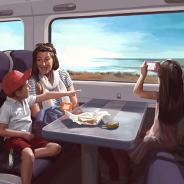Family seated on a train enjoying the summer time 