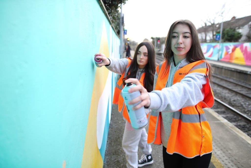 Kayla and Rosa, amongst 20 local young people who created new artwork at Kilbarrack Station.